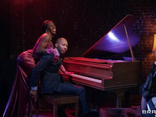 attractive piano master is seduced by two ebony babes