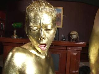 asian covered in gold satisfies a dude